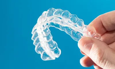 A close up of Invisalign braces
