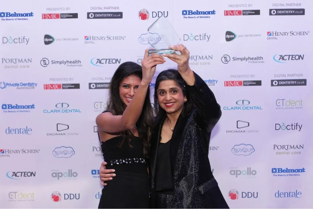 Dr. Shabnam Zai and Dr. Nikita Mehta and the West House Dental team in Pinner receiving a dentistry award for the best dentist in the South of England